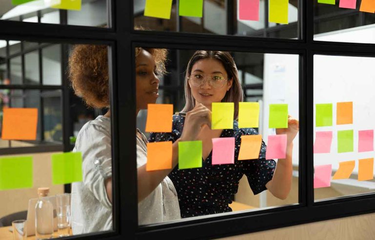 Scrum team struggling with inefficiencies due to merging the Product Owner and Scrum Master roles.